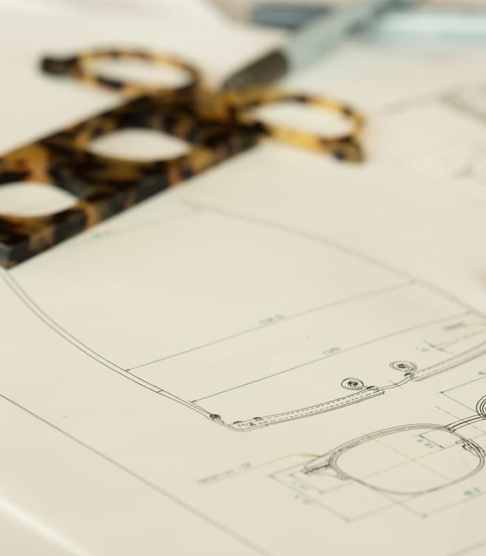 Eine CAD Designzeichnung einer Lunor Fassung auf Papier